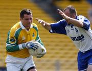 31 July 2004; Kevin Ludlow, Leitrim, in action against Jacko Kiely, Waterford. All-Ireland Junior Football Championship Final, Leitrim v Waterford, Semple Stadium, Thurles, Co. Tipperary. Picture credit; Brendan Moran / SPORTSFILE