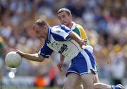 31 July 2004; Jacko Kiely, Waterford, in action against Barry McWeeney, Leitrim. All-Ireland Junior Football Championship Final, Leitrim v Waterford, Semple Stadium, Thurles, Co. Tipperary. Picture credit; Brendan Moran / SPORTSFILE