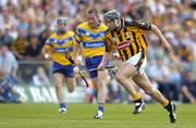 31 July 2004; Eddie Brennan, Kilkenny, in action against David Hoey, Clare. Guinness All-Ireland Hurling Championship Quarter Final Replay, Clare v Kilkenny, Semple Stadium, Thurles, Co. Tipperary. Picture credit; Brendan Moran / SPORTSFILE
