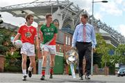 16 September 2013; Powering the GAA Minors: electric Ireland linked up with Minor GAA finalists, Shea Hamill, left, Tyrone vice-captain, and Stephen Coen, Mayo captain, with Jim Dollard, Executive Director, Electric Ireland, ahead of the 2013 electric Ireland GAA Football and Hurling All-Ireland Minor Championship Finals to announce that Electric Ireland have committed a prize fund of €10,000 to the county boards of the winning Football and Hurling Minor teams in order to promote the Minor game in their county. Croke Park, Dublin. Picture credit: Brendan Moran / SPORTSFILE