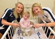 16 September 2013; Galway camogie stars Orla Kilkenny, left, and Brenda Hanney with 13-month-old Zoe Garry, from Ballinteer, Dublin, and the O'Duffy Cup on a visit by the All-Ireland Senior & Intermediate Camogie Champions to Our Lady's Children's Hospital, Crumlin. Picture credit: Stephen McCarthy / SPORTSFILE