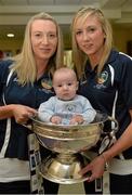 16 September 2013; Galway camogie stars Orla and Niamh Kilkenny with 3-month-old Charlie D'Arcy, from Palmerstown, Dublin, and the O'Duffy Cup on a visit by the All-Ireland Senior & Intermediate Camogie Champions to Our Lady's Children's Hospital, Crumlin. Picture credit: Stephen McCarthy / SPORTSFILE