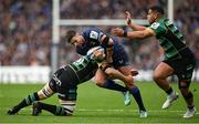 4 May 2024; Ross Byrne of Leinster is tackled by Northampton Saints players Angus Scott-Young, left, and Sam Matavesi during the Investec Champions Cup semi-final match between Leinster and Northampton Saints at Croke Park in Dublin. Photo by Brendan Moran/Sportsfile