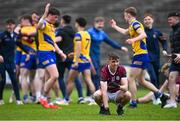4 May 2024; Niall Mannion of Galway reacts as Roscommon players celebrate after the Connacht GAA Football U20 Championship final match between Roscommon and Galway at Hastings Insurance MacHale Park in Castlebar, Mayo. Photo by Ben McShane/Sportsfile
