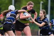 4 May 2024; Ciánna Stacey of Portdara is tackled by Cathlin Hynes, 16, and Ellis Belle Carty of Wexford Wanderers during the Leinster Rugby Bank of Ireland Girls Youth Finals Day match between Portdara and Wexford Wanderers at Energia Park in Dublin. Photo by Shauna Clinton/Sportsfile