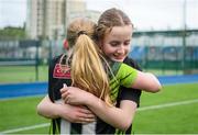 4 May 2024; Caoimhe Murphy of Portdara celebrates with team-mate Matilda Pearson after their side's victory in the Leinster Rugby Bank of Ireland Girls Youth Finals Day match between Portdara and Wexford Wanderers at Energia Park in Dublin. Photo by Shauna Clinton/Sportsfile