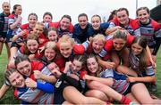 4 May 2024; Mullingar players celebrate after their side's victory in the Leinster Rugby Bank of Ireland Girls Youth Finals Day match between Mullingar and Rhinos at Energia Park in Dublin. Photo by Shauna Clinton/Sportsfile