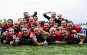 4 May 2024; Mullingar players, including captain Muireann Foy, centre, celebrate after their side's victory in the Leinster Rugby Bank of Ireland Girls Youth Finals Day match between Mullingar and Rhinos at Energia Park in Dublin. Photo by Shauna Clinton/Sportsfile