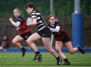 4 May 2024; Molly Whately of Skerries-Dundalk is tackled by Aoife Hughes of Tullamore during the Leinster Rugby Bank of Ireland Girls Youth Finals Day match between Skerries-Dundalk and Tullamore at Energia Park in Dublin. Photo by Shauna Clinton/Sportsfile
