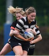 4 May 2024; Nicole Dungan of Skerries-Dundalk is tackled by Aoibhe Kelly of Tullamore during the Leinster Rugby Bank of Ireland Girls Youth Finals Day match between Skerries-Dundalk and Tullamore at Energia Park in Dublin. Photo by Shauna Clinton/Sportsfile