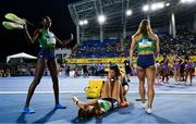 4 May 2024; The Ireland women's 4x400m relay team, from left, Rhasidat Adeleke. Sharlene Mawdsley, Phil Healy and Sophie Becker react after winning heat 3 of the women's 4x400m relays in a national record of 3:24.38 to qualify for the Paris 2024 Olympic Games during day one of the World Athletics Relays at Thomas A Robinson National Stadium in Nassau, Bahamas. Photo by Erik van Leeuwen/Sportsfile