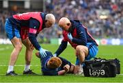 4 May 2024; Ciarán Frawley of Leinster receives medical attention from Leinster head physiotherapist Garreth Farrell and team doctor and exercise medicine consultant Dr Jim McShane after picking up an injury during the Investec Champions Cup semi-final match between Leinster and Northampton Saints at Croke Park in Dublin. Photo by Sam Barnes/Sportsfile