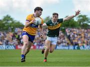 5 May 2024; Ronan Lanigan of Clare in action against Dara Moynihan of Kerry during the Munster GAA Football Senior Championship final match between Kerry and Clare at Cusack Park in Ennis, Clare. Photo by John Sheridan/Sportsfile