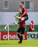5 May 2024; Stephen Kinsella of Gorey Rangers celebrates with teammate Paul Brennan, top, after scoring their side's first goal during the FAI Junior Cup final match between Cockhill Celtic and Gorey Rangers at Eamonn Deacy Park in Galway. Photo by Ben McShane/Sportsfile