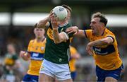 5 May 2024; Sean O'Shea of Kerry in action against Alan Sweeney of Clare during the Munster GAA Football Senior Championship final match between Kerry and Clare at Cusack Park in Ennis, Clare. Photo by Brendan Moran/Sportsfile