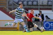 5 May 2024; Paul Brennan of Gorey Rangers has a shot on goal despite the attention of Lee McLaughlin of Cockhill Celtic during the FAI Junior Cup final match between Cockhill Celtic and Gorey Rangers at Eamonn Deacy Park in Galway. Photo by Ben McShane/Sportsfile