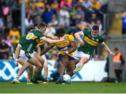 5 May 2024; Ikem Ugwueru of Clare shoots to score his side's first goal despite the efforts of Sean O'Shea of Kerry during the Munster GAA Football Senior Championship final match between Kerry and Clare at Cusack Park in Ennis, Clare. Photo by John Sheridan/Sportsfile