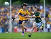 5 May 2024; Manus Doherty of Clare in action against Stephen O'Brien of Kerry during the Munster GAA Football Senior Championship final match between Kerry and Clare at Cusack Park in Ennis, Clare  Photo by John Sheridan/Sportsfile