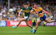 5 May 2024; Sean O'Shea of Kerry is tackled by Darragh Bohannon of Clare during the Munster GAA Football Senior Championship final match between Kerry and Clare at Cusack Park in Ennis, Clare. Photo by Brendan Moran/Sportsfile