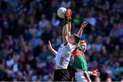 5 May 2024; Galway goalkeeper Connor Gleeson wins possession ahead of Ryan O'Donoghue of Mayo during the Connacht GAA Football Senior Championship final match between Galway and Mayo at Pearse Stadium in Galway. Photo by Piaras Ó Mídheach/Sportsfile