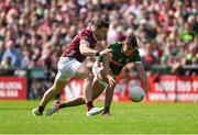 5 May 2024; Tommy Conroy of Mayo in action against Damien Comer of Galway during the Connacht GAA Football Senior Championship final match between Galway and Mayo at Pearse Stadium in Galway. Photo by Daire Brennan/Sportsfile