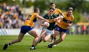 5 May 2024; Cillian Burke of Kerry in action against Gavin Murray and Brian McNamara of Clare during the Munster GAA Football Senior Championship final match between Kerry and Clare at Cusack Park in Ennis, Clare. Photo by Brendan Moran/Sportsfile