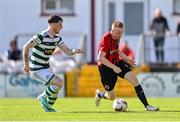 5 May 2024; Paul Brennan of Gorey Rangers in action against Lee McLaughlin of Cockhill Celtic during the FAI Junior Cup final match between Cockhill Celtic and Gorey Rangers at Eamonn Deacy Park in Galway. Photo by Ben McShane/Sportsfile