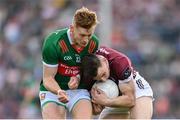 5 May 2024; Matthew Tierney of Galway in action against Jack Carney of Mayo during the Connacht GAA Football Senior Championship final match between Galway and Mayo at Pearse Stadium in Galway. Photo by Seb Daly/Sportsfile