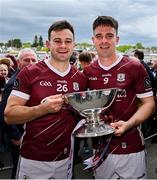 5 May 2024; Galway players Cillian McDaid, left, and Seán Kelly with the trophy after their side's victory in the Connacht GAA Football Senior Championship final match between Galway and Mayo at Pearse Stadium in Galway. Photo by Seb Daly/Sportsfile