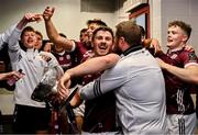 5 May 2024; Shane Walsh of Galway celebrates with Galway coach Cian O'Neill while holding the Nestor Cup in the dressing room after victory in the Connacht GAA Football Senior Championship final match between Galway and Mayo at Pearse Stadium in Galway. Photo by Piaras Ó Mídheach/Sportsfile