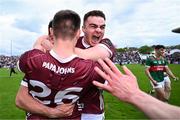 5 May 2024; Galway players, from left, Sam O'Neill, 26, Seán Kelly and Daniel Ó Flaherty celebrate after their side's victory in the Connacht GAA Football Senior Championship final match between Galway and Mayo at Pearse Stadium in Galway. Photo by Piaras Ó Mídheach/Sportsfile