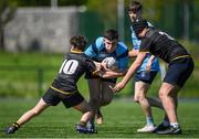 5 May 2024; Sean Casey of North Meath/ MU Barnhall is tackled by Ultan Kelly, left, and Dylan O'Connell of Westmanstown/ St Marys during the Leinster Rugby Bank of Ireland Schools Youth Finals Day match between North Meath/ MU Barnhall and Westmanstown/ St Marys at Energia Park in Dublin. Photo by Shauna Clinton/Sportsfile