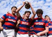 5 May 2024; Clontarf players, including captain Michael Barnes, centre, celebrate after their side's victory in the Leinster Rugby Bank of Ireland Schools Youth Finals Day match between Clontarf and Newbridge at Energia Park in Dublin. Photo by Shauna Clinton/Sportsfile