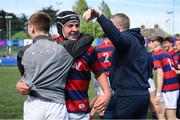 5 May 2024; Gavin Keegan of Clontarf celebrates with management after their side's victory in the Leinster Rugby Bank of Ireland Schools Youth Finals Day match between Clontarf and Newbridge at Energia Park in Dublin. Photo by Shauna Clinton/Sportsfile