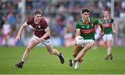 5 May 2024; Tommy Conroy of Mayo in action against Jack Glynn of Galway during the Connacht GAA Football Senior Championship final match between Galway and Mayo at Pearse Stadium in Galway. Photo by Seb Daly/Sportsfile