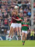 5 May 2024; Paul Conroy of Galway in action against Stephen Coen of Mayo during the Connacht GAA Football Senior Championship final match between Galway and Mayo at Pearse Stadium in Galway. Photo by Seb Daly/Sportsfile