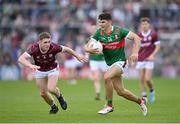 5 May 2024; Tommy Conroy of Mayo in action against Jack Glynn of Galway during the Connacht GAA Football Senior Championship final match between Galway and Mayo at Pearse Stadium in Galway. Photo by Seb Daly/Sportsfile