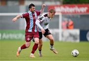 6 May 2024; Hayden Muller of Dundalk in action against Ryan Brennan of Drogheda United during the SSE Airtricity Men's Premier Division match between Drogheda United and Dundalk at Weavers Park in Drogheda, Louth. Photo by Ben McShane/Sportsfile