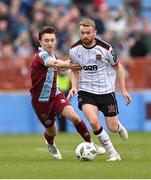 6 May 2024; Paul Doyle of Dundalk in action against Darragh Markey of Drogheda United during the SSE Airtricity Men's Premier Division match between Drogheda United and Dundalk at Weavers Park in Drogheda, Louth. Photo by Ben McShane/Sportsfile