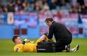 6 May 2024; Drogheda United goalkeeper Jethren Barr receives medical attention during the SSE Airtricity Men's Premier Division match between Drogheda United and Dundalk at Weavers Park in Drogheda, Louth. Photo by Ben McShane/Sportsfile