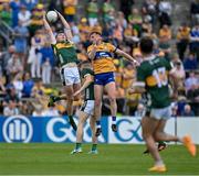 5 May 2024; Diarmuid O'Connor of Kerry catches a kickout ahead of Emmet McMahon of Clare during the Munster GAA Football Senior Championship final match between Kerry and Clare at Cusack Park in Ennis, Clare. Photo by Brendan Moran/Sportsfile