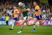 5 May 2024; Sean O'Shea of Kerry in action against Darragh Bohannon of Clare during the Munster GAA Football Senior Championship final match between Kerry and Clare at Cusack Park in Ennis, Clare. Photo by Brendan Moran/Sportsfile