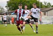 6 May 2024; Cameron Elliott of Dundalk in action against Aaron McNally of Drogheda United during the SSE Airtricity Men's Premier Division match between Drogheda United and Dundalk at Weavers Park in Drogheda, Louth. Photo by Ben McShane/Sportsfile
