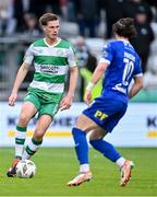 6 May 2024; Daniel Cleary of Shamrock Rovers in action against Connor Parsons of Waterford during the SSE Airtricity Men's Premier Division match between Shamrock Rovers and Waterford at Tallaght Stadium in Dublin. Photo by Piaras Ó Mídheach/Sportsfile