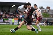 6 May 2024; James Clarke of Bohemians in action against Maurice Nugent, right, and Jeannot Esua of Galway United during the SSE Airtricity Men's Premier Division match between Bohemians and Galway United at Dalymount Park in Dublin. Photo by Ben McShane/Sportsfile