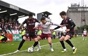 6 May 2024; Leo Gaxha of Galway United in action against Declan McDaid, left, and Paddy Kirk of Bohemians during the SSE Airtricity Men's Premier Division match between Bohemians and Galway United at Dalymount Park in Dublin. Photo by Ben McShane/Sportsfile