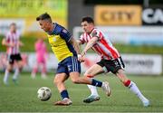 6 May 2024; John O'Sullivan of Shelbourne in action against Ciarán Coll of Derry City during the SSE Airtricity Men's Premier Division match between Derry City and Shelbourne at The Ryan McBride Brandywell Stadium in Derry. Photo by Stephen McCarthy/Sportsfile