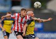 6 May 2024; Ronan Boyce of Derry City in action against Mark Coyle of Shelbourne during the SSE Airtricity Men's Premier Division match between Derry City and Shelbourne at The Ryan McBride Brandywell Stadium in Derry. Photo by Stephen McCarthy/Sportsfile