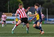 6 May 2024; Ronan Boyce of Derry City in action against Matty Smith of Shelbourne during the SSE Airtricity Men's Premier Division match between Derry City and Shelbourne at The Ryan McBride Brandywell Stadium in Derry. Photo by Stephen McCarthy/Sportsfile