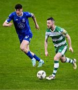 6 May 2024; Jack Byrne of Shamrock Rovers in action against Harvey Macadam of Waterford during the SSE Airtricity Men's Premier Division match between Shamrock Rovers and Waterford at Tallaght Stadium in Dublin. Photo by Piaras Ó Mídheach/Sportsfile